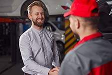 happy-customer-and-mechanic-in-workshop